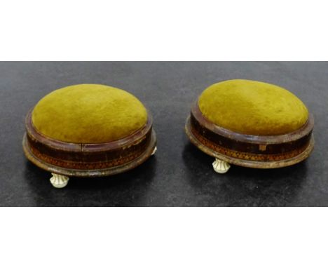 Pair of small round foot stools with up[holstered tops and ceramic bun feet, (2)