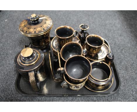 A tray of 24kt gold plated Grecian style china 