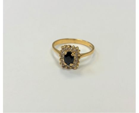 An 18ct gold sapphire and diamond ring