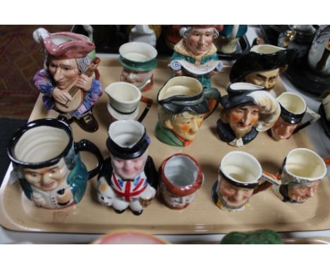 A tray of fourteen ceramic character jugs (14)