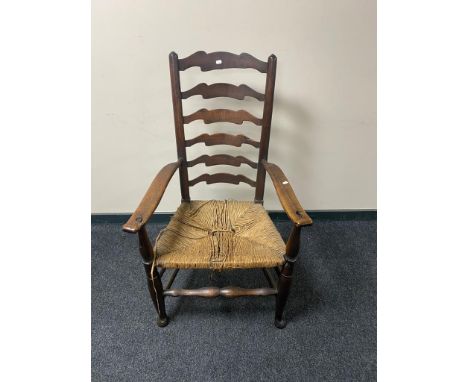 A nineteenth century oak country ladder backed chair 
