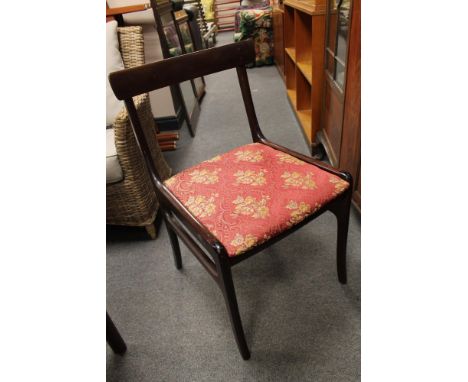 A contemporary mahogany effect dining table and four chairs 