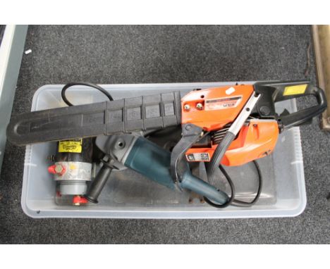 A petrol chainsaw together with a Bosch grinder etc 