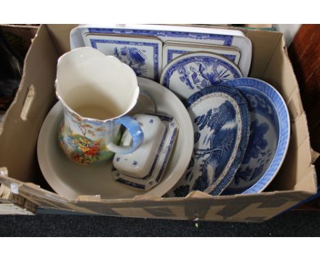 A box of willow pattern plates, place mats, jug and basin etc 
