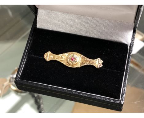 A Victorian 9ct gold ruby and pearl set brooch CONDITION REPORT: 1.6g