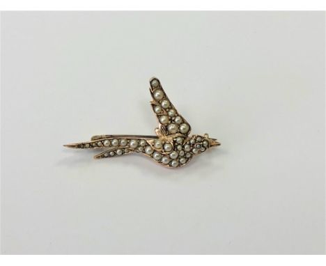 A 15ct gold pearl set swallow brooch
