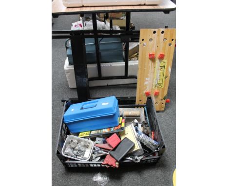 A folding workmate bench together with a crate of tools 
