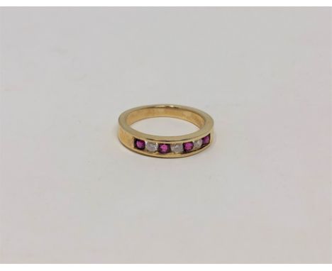 An 18ct gold ruby and diamond ring, size J CONDITION REPORT: 2.9g