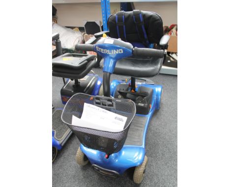 A Sterling mobility scooter with key and charger 
