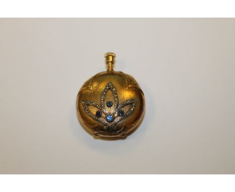 An 18ct gold fob watch set with sapphires and diamonds CONDITION REPORT: Diameter 26mm. Weight 16.9g. Winds a little way and 