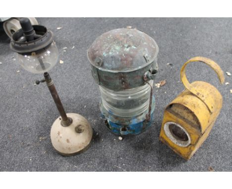 Two twentieth century railway lamps together with a copper topped light and paraffin lamp 