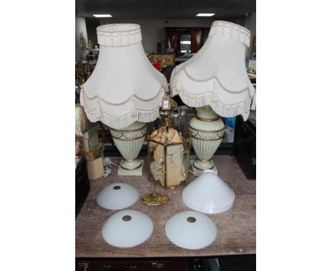 A brass ceiling light together four lamp shades and a pair of table lamps 