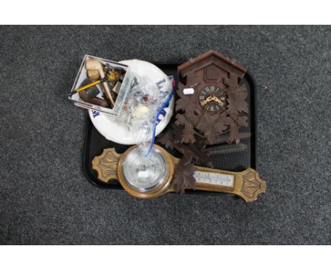 A carved oak barometer, cuckoo clock, box of pipes, whistle etc 