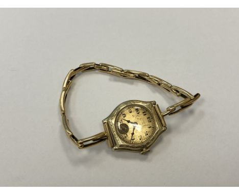 A lady's 14ct gold cased wristwatch on yellow metal expanding strap, together with a lady's 9ct gold wristwatch on leather st