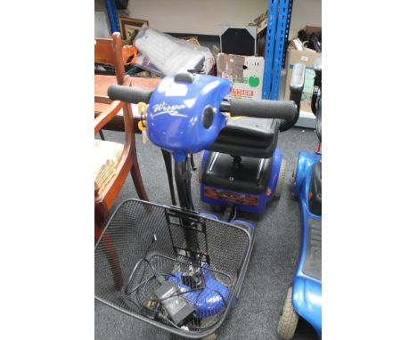 A Wispa mobility scooter with keys and charger 