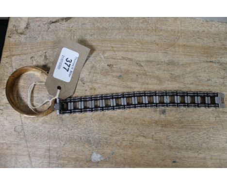 A Louis Vuitton bangle together with a further chain bracelet 