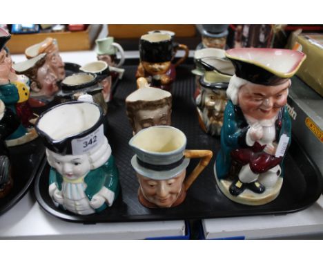 A tray of twelve ceramic character jugs (12)