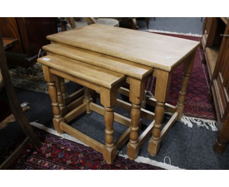 A nest of light oak tables 