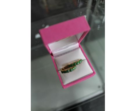 A pair of high carat gold mounted jade hoop earrings 