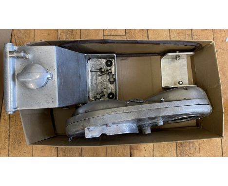 Norton spares, to include a Norton alloy oil tank, support bracket and fittings, and an inner and outer alloy chaincase with 