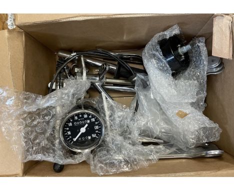 Assorted Norton spares, to include two rear sets of Norton clip ons, two Converta clock bricts, new speedo and rev counter, t