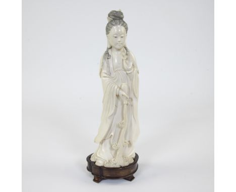 An ivory statue of the immortal Goddess Guanyin pouring her bottle of Amrita over humanity and her other hand in ‘Vitarka Mud