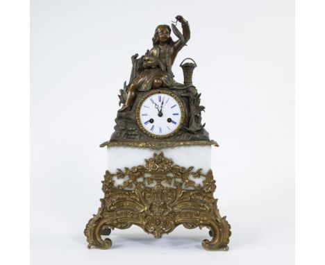 A mantel clock of gilt and brown patinated bronze and alabaster, top decorated with a boy with fish, medaille d'or Japy Frère