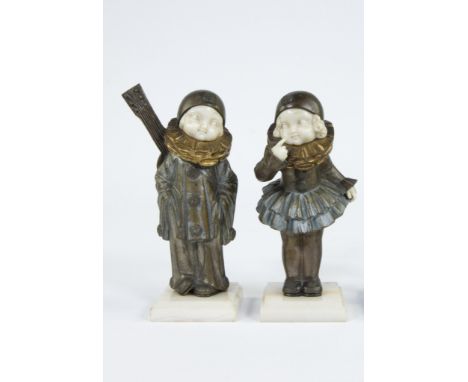 Pair of bronze Chryselephantine figurines with hands and face in ivory depicting a boy with guitar and a girl asking for kiss