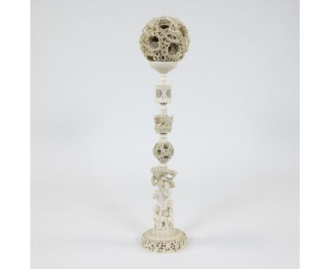 Ivory magic ball or ‘Canton ball’ on very high stand with exceptional carving with +/- 15 openwork layers ajour carved, the o