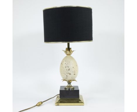 House BARBIER, table lamp model 'Oxford' decorated with an egg in travertine and foliage in gilded metal, the whole resting o