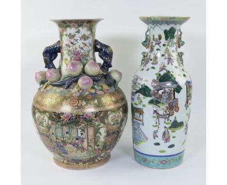 A large multi-coloured and gilded Chinese porcelain vase with a Canton decoration of characters and with pomegranates in high