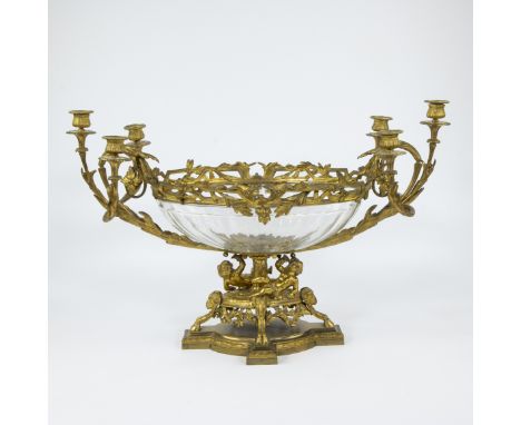 Milieu de table with oval white crystal bowl encased in a gilt bronze frame with candle stick branches and base decorated wit