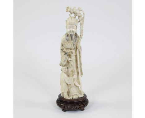 Ivory statue of the God of Longevity ‘Shoulao’ or ‘Lao-Tzu’ in the form of an old man with staff accompanied by a child, Chin