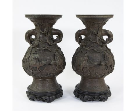 Pair of Chinese bronze vases decorated in high relief with decor of flowers and buffalo with children, period RepublicKoppel 