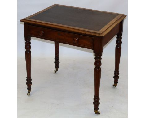A Victorian mahogany writing tableThe rectangular top with inset leatherette writing surface and shaped overhanging borders, 