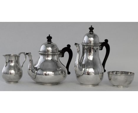 A silver four piece tea and coffee service Of plain baluster form, with domed lids, wooden handles and turned circular wooden