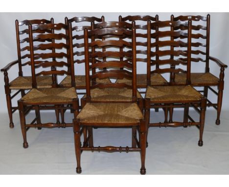 A set of eight Lancashire oak ladder back dining chairs
Comprising two carvers and six singles, each with six part ladder bac