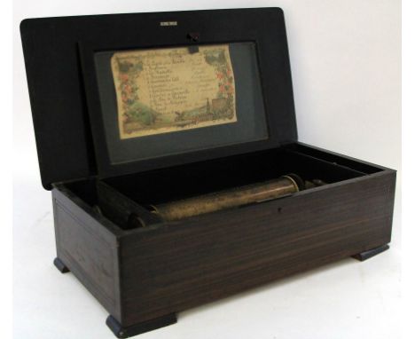 A 19th century Swiss twelve air musical boxWith inlaid rosewood case, bears original label with songs to interior, raised on 