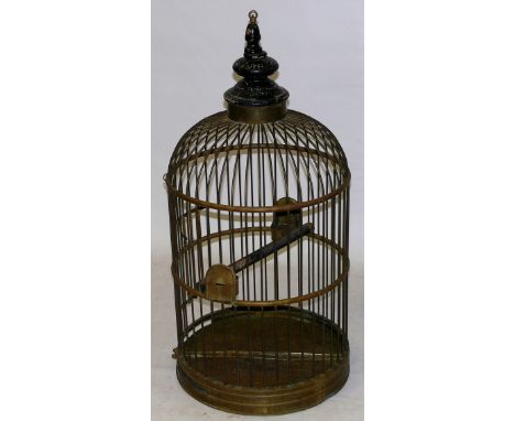 A Victorian style brass parrot cageHaving a painted turned wood finial above the domed form cage, height approx 100cm, diamet