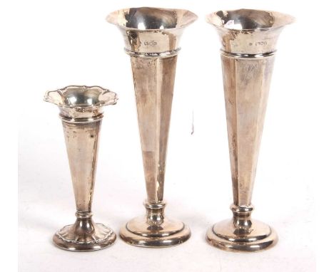 Mixed Lot: Pair of Edwardian silver trumpet vases with tapering hexagonal stems to loaded circular bases, hallmarked for Lond