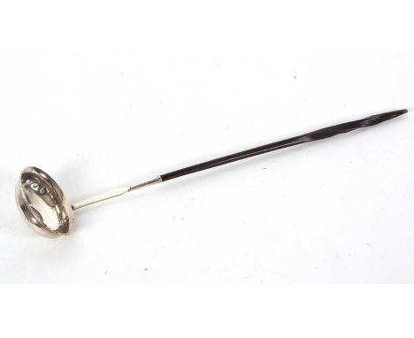 A early 19th Century silver toddy ladle having a twisted baleen handle, oval shaped bowl with a Newcastle Northumberland 19th