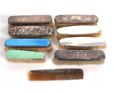 Group of six silver backed dressing table brushes together with two enamel examples, (one silver) and a silver framed comb
