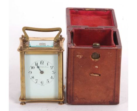 A Hamilton &amp; Co carriage clock, four glass sides, key wound movement and brass case, the clock box is present, white enam