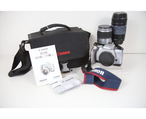Canon EOS 300V 35mm camera plus lens of 28-90mm &amp; 75-300 mm . Original Canon Case.  See photos for details.  