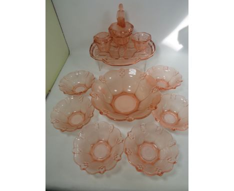Peach Glass Dressing table set with Romanesque design along with a peach glass dish set. See photos. 