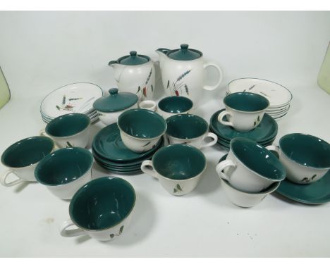 Part Tea Set by Denby in the Greenwheat Pattern.  Mostly in good condition but one or two of the saucers have minor chips. Se