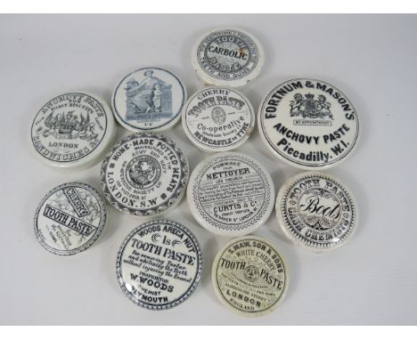 Eleven vintage ceramic paste pot lids.