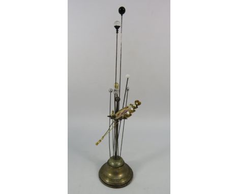White metal Hatpin stand and selection of hat pins.