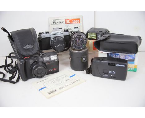 Mixed photographic lot to include a Pentax K1000 plus accessories for same plus tow other digital cameras.  See photos. 