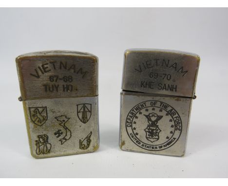 Two Vietnam War Zippo lighters in need of TLC.